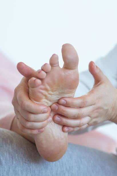 istock Hand making thai feet massage. Alternative medicine and thai massage concept 1369262018