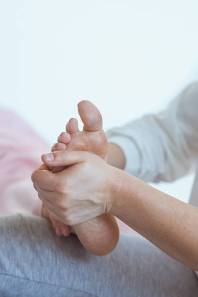 istock Hands making thai feet massage. Alternative medicine and thai massage concept 1369262109