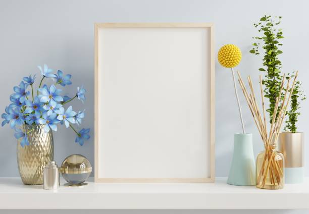 istock Interior poster mockup with vertical wooden frame in blue interior background. 1369262157