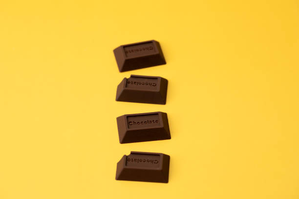 istock chocolate pieces on yellow background 1369264415