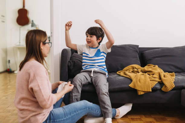 istock mother and child at home 1369264448