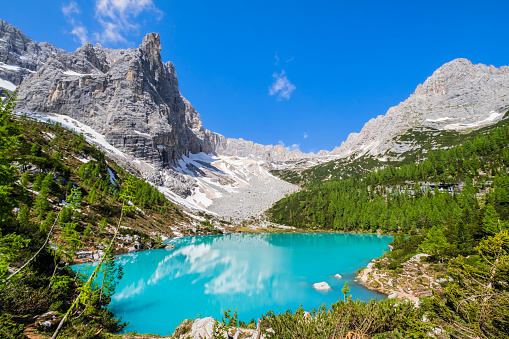Dito di Dio (Finger of God) in the Sorapiss mountain in the Dolomites, with Lago di Sorapiss at its foot