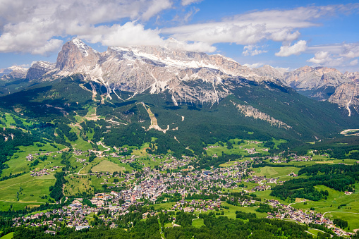 The town of Cortina d’Ampezzo with in background the mountain group of Tofane, Dolomites