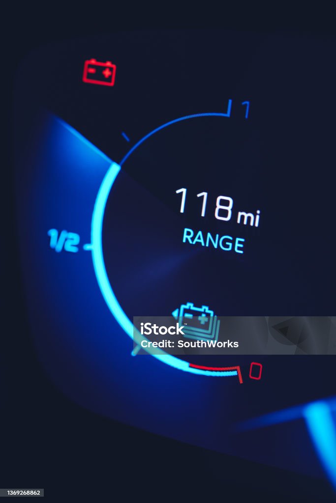 Close-in shot of electric car battery range gauge Close-in shot of electric car battery range gauge in blue Electric Vehicle Stock Photo