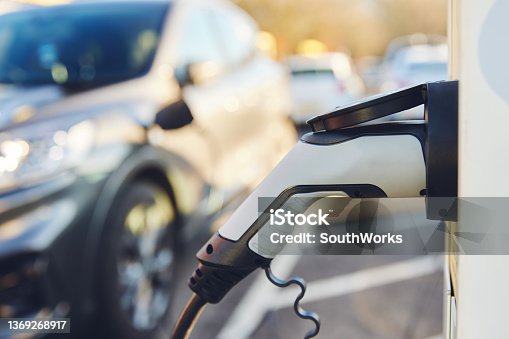 istock Electric Car Charging Point with copy space 1369268917
