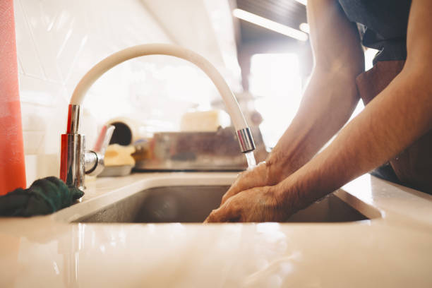 istock Chef washing his hands in a restaurant kitchen sink 1369270600