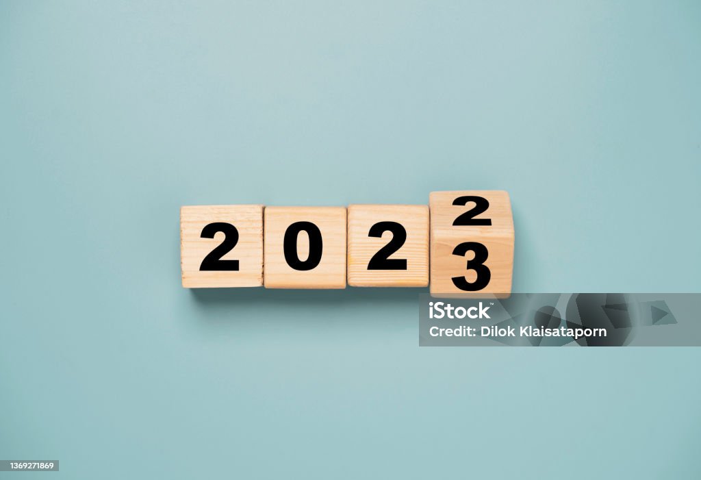 Wooden block cube flipping between 2022 to 2023 for change and preparation merry Christmas and happy new year. 2023 Stock Photo