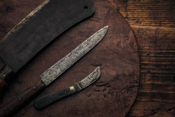 istock three vintage meat cutting utensils on an old wood cutting board 1369273303