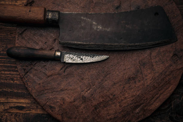 istock old rusty cleaver and little utility knife on top of rustic cutting board with copy space 1369273462