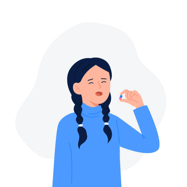 A cute girl drinks a pill. Cartoon character standing and holding pill capsule or vitamin medication in hand. Medical drugs and vitamin concept. Vector flat colorful illustration. A cute girl drinks a pill. Cartoon character standing and holding pill capsule or vitamin medication. Medical drugs and vitamin concept. Vector flat colorful illustration. sad girl face clip art stock illustrations