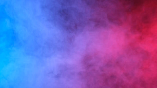 istock Red, blue, purple smoke on black background 1369277647