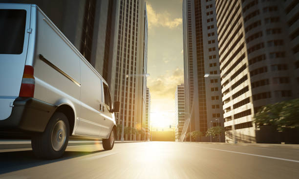 istock Delivery white van in the city street 1369278917