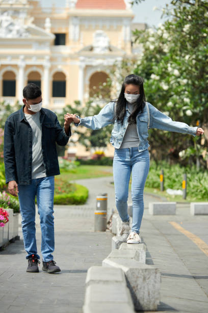 istock Young Couple Walking in City Park 1369279030