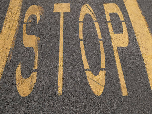 istock Stop sign on the asphalt 1369279652