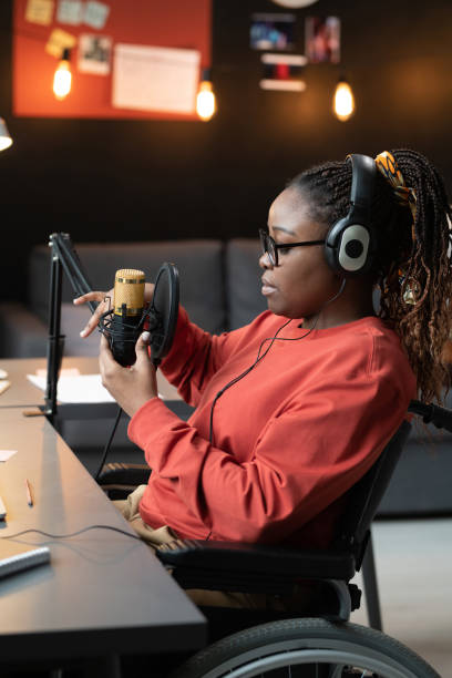 istock Woman with disability preparing for online broadcasting 1369279918