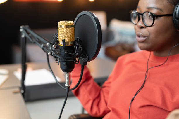 istock Woman speaking to the microphone 1369279933