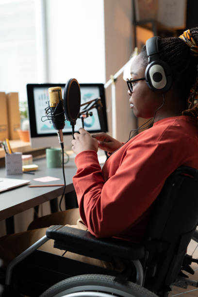 istock Woman with microphone has live stream 1369279958