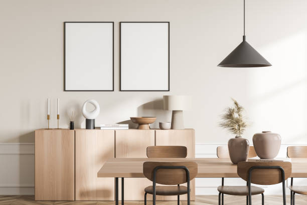 istock Light guest room interior with chairs, drawer with decoration, mockup posters 1369281592