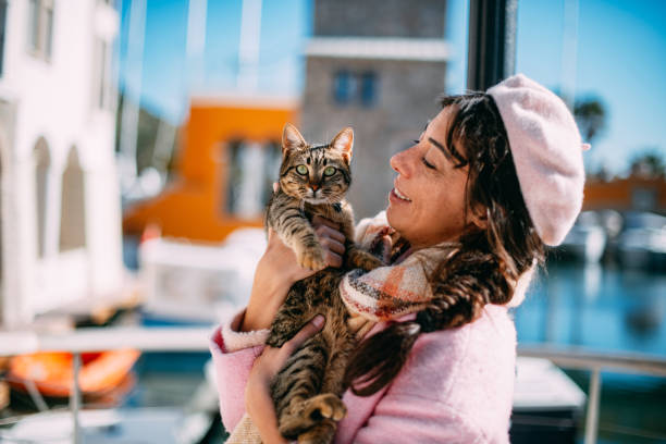 istock Cute Woman and Tabby Cat 1369281932