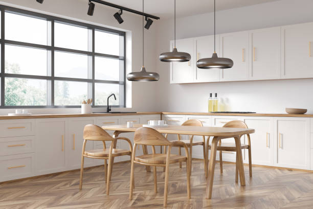 istock Kitchen corner and dining room combo in white. Corner view. 1369282684
