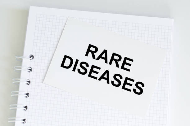 istock Paper with text rare disease on white table,medical concept 1369284289