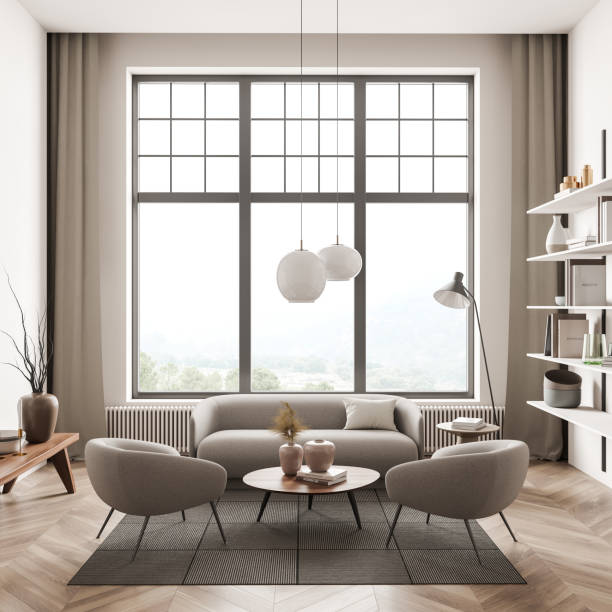 istock Minimalist relaxing room interior with armchairs and sofa near window 1369284371