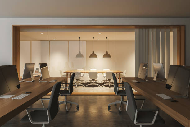 istock Bright office room interior with desktops, armchairs, conference board 1369285033