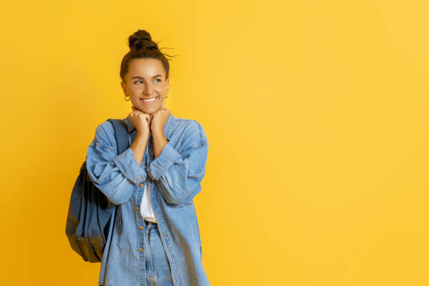istock young woman on bright color background 1369286170