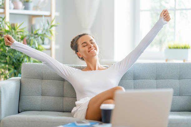 istock woman working on laptop at home. 1369287055