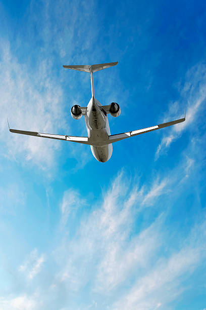 istock XXL corporate jet airplane flying in bright sky 136928794