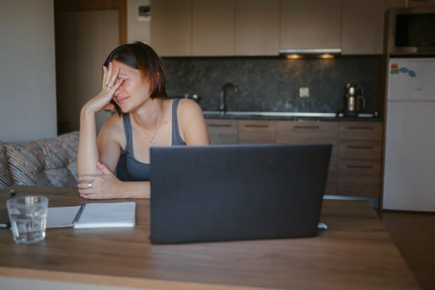 istock young asian woman at home, remote work 1369288628
