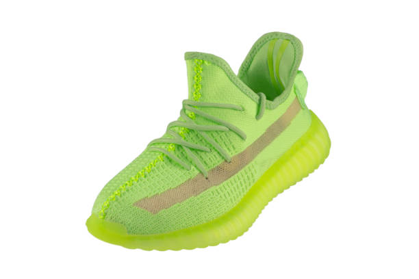 istock Green rag sneaker with a polyurethane sole on a white background. 1369288832