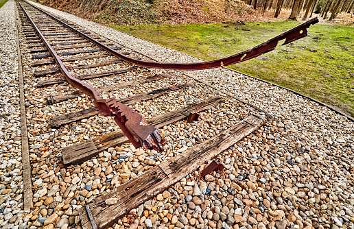 broken train rails end with no stop.