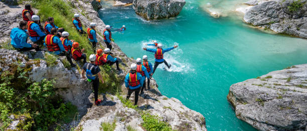 istock Jumping into natural swimming pool in cold mountain water 1369290040