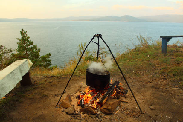 Rest on the lake. Cooking in a pot. Background. Landscape.