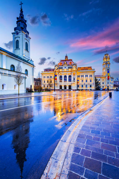 Oradea, Crisana - City Hall rainy day reflection, Transylvania, Romania destination. Oradea, Romania. Cloudy rainy day touristic destination Art Nouveau city in historic Crisana - Transylvania, Eastern Europe romania stock pictures, royalty-free photos & images