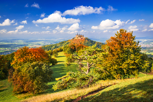 Burg Hohenzollern, Germany. Autumn colored landscape Hohenzollern Castle in the Zollernalbkreis district Swabian Alps - Baden-Wurttemberg.