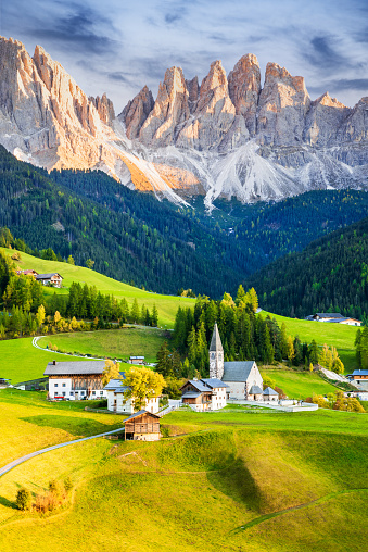 Val di Funes, Italy - Beautiful Santa Maddalena village with idyllic Dolomites mountains in Funes valley, South Tyrol, Italian Alps at autumn sunset.
