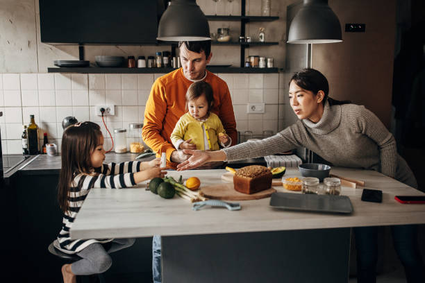 istock Family in kitchen at home 1369291742