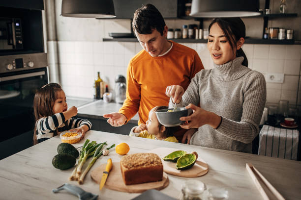 istock Family in kitchen at home 1369292551