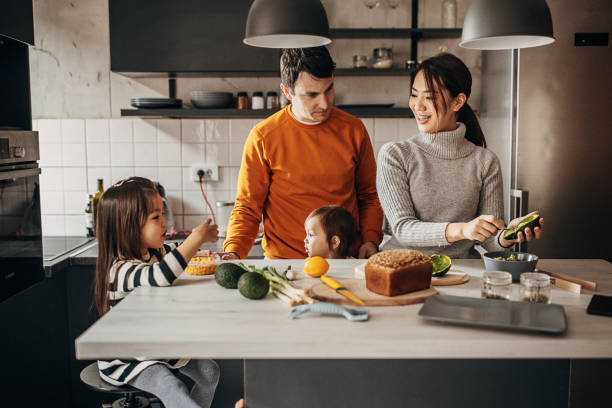 istock Family in kitchen at home 1369292571