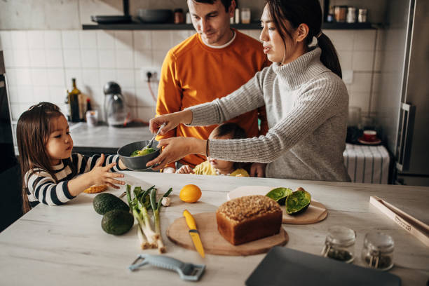 istock Family in kitchen at home 1369292598