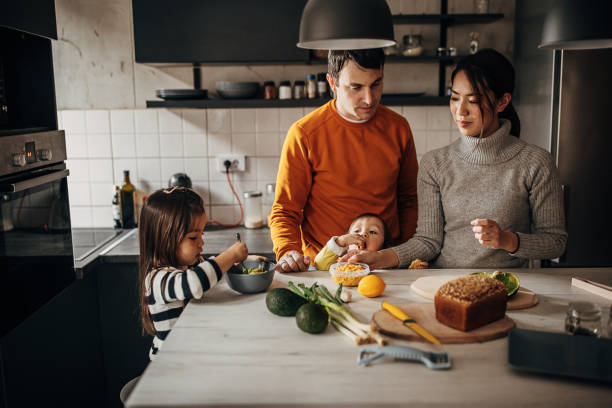 istock Family in kitchen at home 1369292660