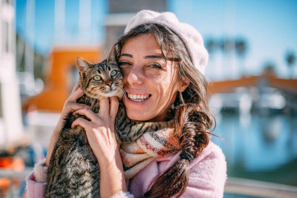 istock Cute Woman and Tabby Cat 1369292861