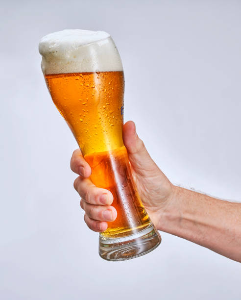 istock hand holding glass of beer 1369292926