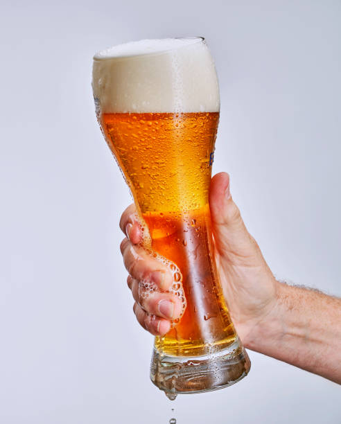 istock hand holding glass of beer 1369292930