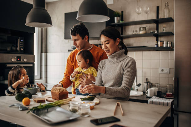 istock Family together in kitchen 1369293030