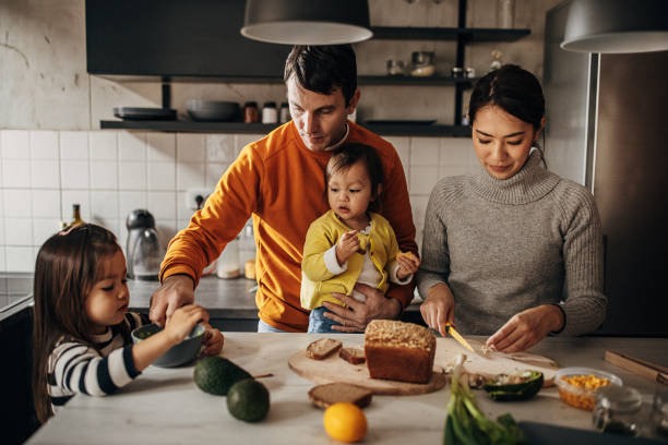 istock Family together in kitchen 1369293083