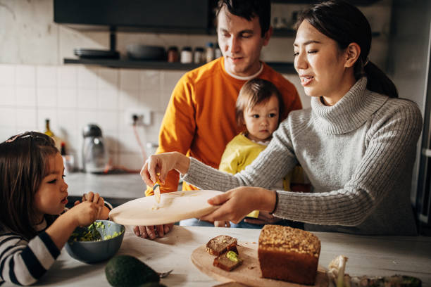 istock Family together in kitchen 1369294451