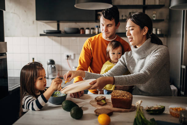 istock Family together in kitchen 1369294499